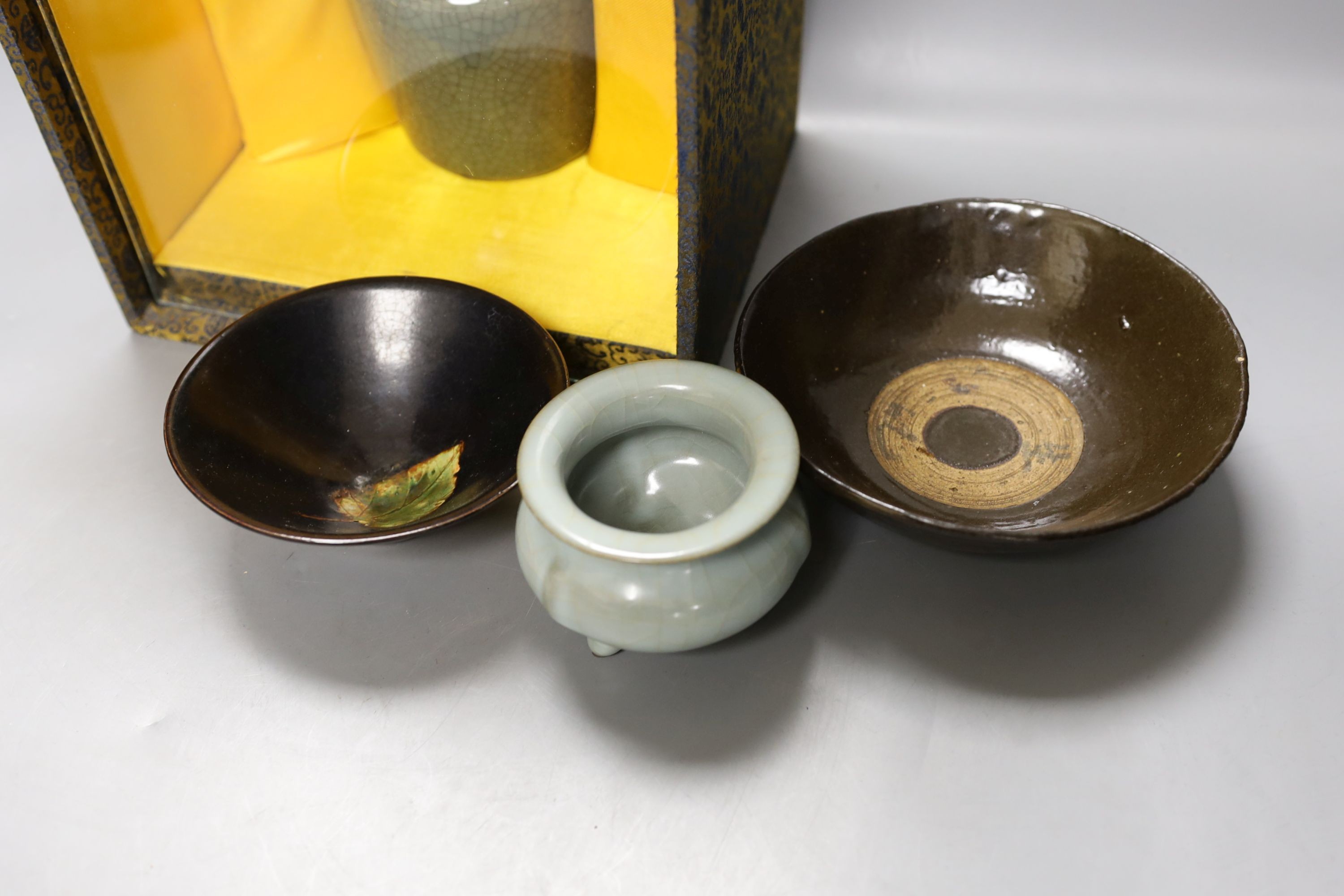 A group of Chinese monochrome ceramics, comprising two crackle glaze vases, tallest 21 cm, one cased, a Jun type dish and tripod censer a leaf impressed bowl and another bowl